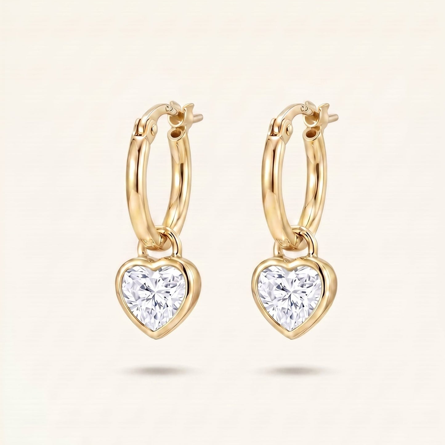 Gold hoop earrings with diamond bezel heart charms
